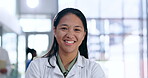Doctor, happy and face of woman in hospital for medical, wellness and life insurance. Medicine, healthcare and expert with portrait of female person in clinic for support, professional and surgery