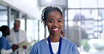 Nurse, happy and face of black woman in hospital for medical, wellness and life insurance. Medicine, healthcare and expert with portrait of person in clinic for support, nursing and surgery