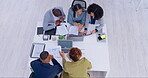 Business people, team and documents in meeting for strategy, brainstorming or project plan above at office. Top view of group or employees with paperwork in teamwork discussion for startup goals