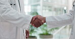 Teamwork, healthcare and doctors shaking hands in the hospital for congratulations or promotion. Medical, partnership and a handshake for thank you with a professional medicine team in the clinic