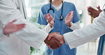 Doctors, handshake and partnership in medical hospital with team to celebrate collaboration or agreement. Group of people as healthcare workers shaking hands for congratulations, success and clapping