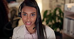 Face, call center and a woman talking with a headset at night for customer service, advice or crm. Happy Indian person working at office for telecom, telemarketing or technical support at help desk