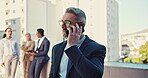 Corporate, talking and businessman on a phone call at work for networking or communication. Contact, ceo and an executive mature employee or manager speaking on a mobile at the office for discussion