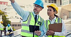 Teamwork, leader or engineers with tablet on construction site for planning, pointing or building a project. Industrial, boss or senior contractor engineering or speaking to contractor for inspection