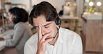 Headache, anxiety and phone call, man at customer service agency and frustrated consultant with sales deadline or problem. Call center consultation, stress and agent at help desk, annoyed with crisis