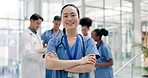 Asian woman, doctor and arms crossed in confidence for healthcare, surgery or leadership at hospital. Portrait of confident female person, nurse or medical professional for health advice at clinic
