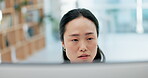 Face, computer and research with a business asian woman reading information online while working in the office. Technology, planning a report or searching the internet and typing a proposal or report