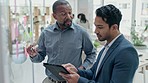 Tablet, planning and mentor coaching an employee on company vision or strategy while brainstorming together. Glass, meeting and sticky notes with a black man business manager talking to a colleague