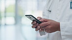 Phone, hands and doctor typing email prescription online, internet or web in a hospital for medical healthcare on mobile app. Professional, closeup and person research medicine or search a website