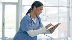 Tablet, research and information with an asian woman nurse in a hospital for innovation or problem solving. Medical, technology and planning with a young medicine professional searching the internet