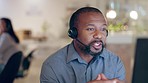 Black man, call center and computer consulting talking about telemarketing and crm work. Office, male professional and customer support online with conversation and advice for contact us discussion 