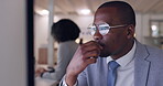 Face, computer and a business black man thinking in the office while working on problem solving at his desk. Technology, glasses and planning with a young male employee reading information online