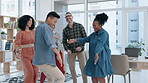 Happy, celebration and designers dance for success, achievement or team building in office. Funny, synergy or excited men with women in workplace for bonus, deal or goal target milestone together