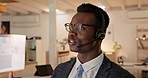 African man, call center and night in office with tech support, talking or listening with voip tech. Black consultant, headphones and microphone for customer service, advice or help in dark workplace