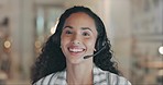 Laughing, face and a woman in a call center at night for online consulting, support and sales advice. Smile, contact us and portrait of a customer service employee in an office for late telemarketing