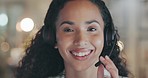 Consultant woman, call center and face with smile, office or mic for advice, question or customer care. Happy crm agent, headphones and contact us in night for tech support, telemarketing or portrait