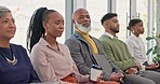 Face, row and black man with business people in an office for an interview, meeting or seminar. Company, team and portrait of an African businessman in an office waiting room with employees at work