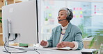 Call centre, talking and technology with senior woman for  for support at office with conference call. Consultant, sales and customer service with mature female or headphones at help desk with tech.
