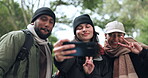 Friends, happy or hikers taking a selfie while hiking outdoors in nature sharing the experience on social media. Winter, forest or active people take a picture or a photo while trekking together