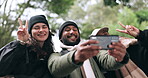 Friends, forest or hikers taking a selfie while hiking outdoors in nature sharing the experience on social media. Winter, happy or active people take a picture or a photo while trekking together