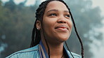 Face, thinking and a happy woman outdoor in nature to relax and breath fresh air to relax. Vacation, calm woods and closeup of a young african girl on a holiday or hike on misty morning with a smile