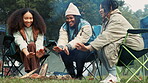 Friends camping, fire and warm hands with flame on trip or adventure in nature, forest or together at a bonfire in winter. Campfire, smoke and group relax on outdoor vacation, holiday or warming hand