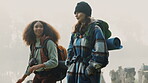 Travel, backpack and friends hiking in the mountain on a cold, overcast morning in nature together. Travel, freedom and adventure with women walking in the wilderness to explore while bonding