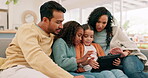 Tablet, family and children with parents at home for online education, e learning or games. Multiracial man, woman and girl kids together on sofa with tech and internet for streaming and development
