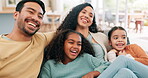 Happy family, laughing and parents watching tv with kids in home for funny movies, film and relax in lounge. Mom, dad and children on sofa for television media, comedy show and streaming subscription