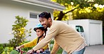 Father, kid and learning on bike outdoor in driveway of neighborhood for family support, help and trust. Excited dad teaching happy young girl on bicycle for fun games, skill or childhood development