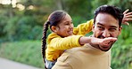 Happy, playful and a father and child in nature for walking, bonding and piggyback. Laughing, family and a young dad with a little girl in a park for weekend fun or activity together with freedom