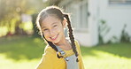 Face, child and girl smile outdoor in garden, park and backyard of home for fun, good mood and play in sunshine. Portrait, happy young female kid and relax in summer, nature and confident in Colombia