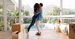 Happy couple, hug and real estate in new home for property, investment or renovation together. Man hugging woman in happiness for moving in, boxes and house for goals, mortgage loan or bond indoors
