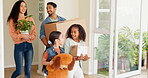 Happy family, box and moving in new home for renovation,  real estate or mortgage loan at the apartment. Father, mother and children walking in house for investment, relocation or property owners