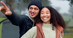 Happy, hug and a camping couple in nature, showing and watching the view together in the morning. Smile, travel and a man and woman speaking with affection while on holiday at a park with a gesture