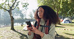 Phone, nature and woman camping, search for location and internet connection or mobile photography in forest or lake. Young african person or camper hiking, video content creation or backpack outdoor