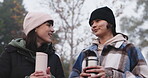 Friends, talking and nature in morning with coffee and conversation with happiness on camp. Girl, together and happy with hot beverage for hiking in outdoor for adventure in natural environment.