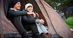 Couple, hug and tent outdoor for camping in nature with love, care and adventure. A young man and woman happy while at a camp site in winter for holiday, travel or vacation to relax in a forest