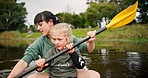 Child, mother and rowing kayak in lake on holiday, vacation and travel together. Mom, girl and kid in canoe, boat and bonding in river, water and fitness exercise on adventure with family outdoor.