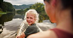 Mother, girl and face in kayak on river on holiday, vacation or travel together. Mom, happy child and portrait in boat, canoeing and bonding at lake, water or learning on family adventure outdoor.