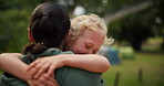 Mother, child and hug at a park outdoor in nature for happiness, adventure or fun play. Woman and excited girl kid embrace in forest for family travel, wellness or freedom with love, support and care