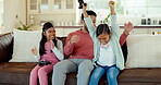 Dad, children gaming and winning a video game, competition or girl playing esports on living room, couch or quality time on sofa. Happy, father hug girls and child in celebration of win in e sports