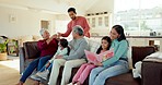 Family, relax and grandparents with kids on sofa for bonding, quality time and relationship in living room. Home, children and mom, dad and senior parents on couch for reading, happiness and love