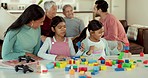 Girl kids, table and building blocks with mother, learning and development in lounge at family house. Children, plastic toys and together with teaching, skills and relax with education in living room