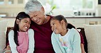 Love, grandmother and children hug on sofa for bonding, quality time and relaxing in living room. Family, happy and grandparent and girls at home having fun on couch for embrace, cuddle and laughing