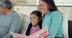 Book, relax and storytelling with mother and daughter on sofa for reading, fairytale and fantasy. Happy, smile and learning with woman and child in living room in family home for child development