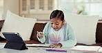 Girl, homework and happy with a tablet, education and answer with distance learning, excited and notebook. Knowledge, female student or kid with technology, lounge and studying with child development