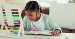 Education, abacus and math with child and homework for learning, future and growth. Games, development and focus with young girl studying in living room at home for kindergarten, school and student