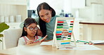 Education, homework and math with child and mother for learning, future and growth. Writing, development and focus with woman and girl studying in family home for kindergarten, school and student