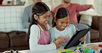 Kids, tablet and home with tech and education app for development with a smile. Living room, children and digital game in a family lounge with internet and youth website with a smile online on tech